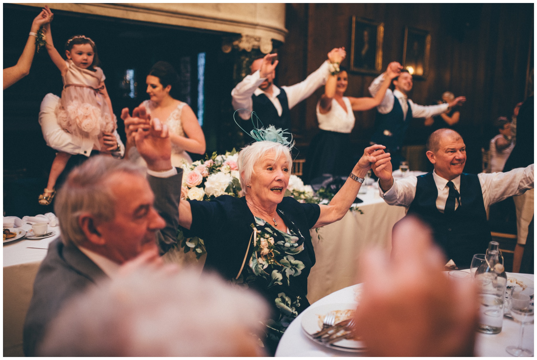 The singing waiters at Thornton Manor wedding get all the wedding guests dancing during the meal and speeches.