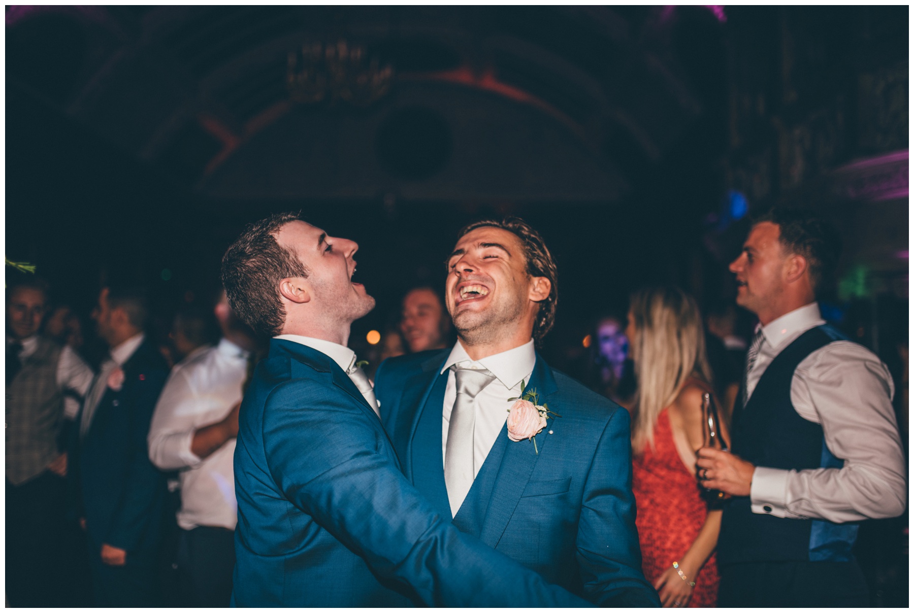 The groom and his Best Man dance and sing and have fun together at Thornton Manor wedding in Cheshire.