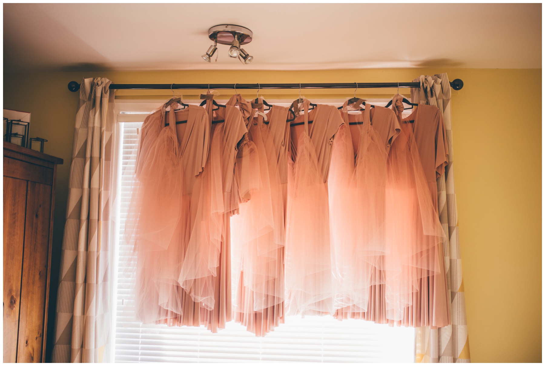 The custom-made dusky pink bridesmaids dresses.