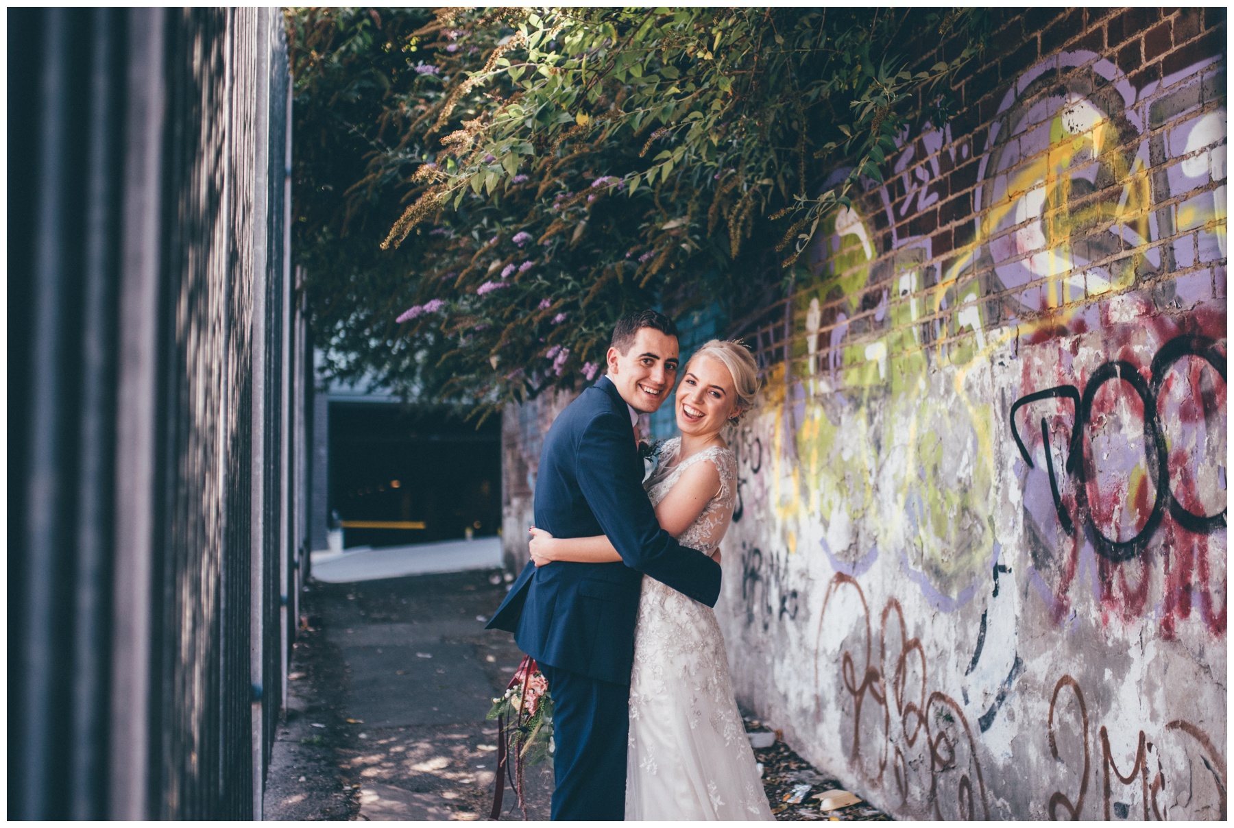 Graffiti covered car park and streets in Sheffield city centre wedding make a great back-drop for bride and groom.