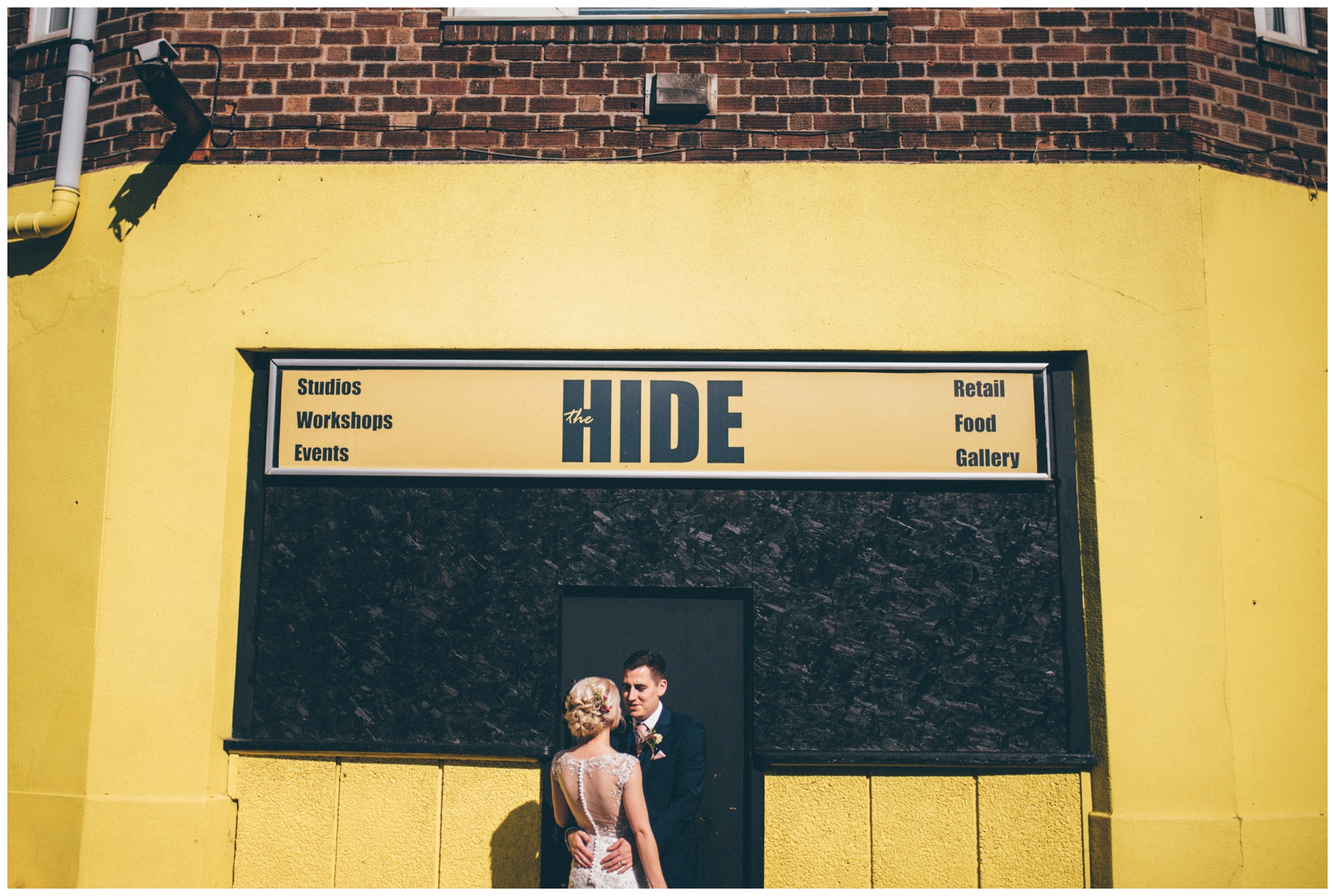 Bride and groom stand outside The Hide, their Sheffield city centre wedding venue.