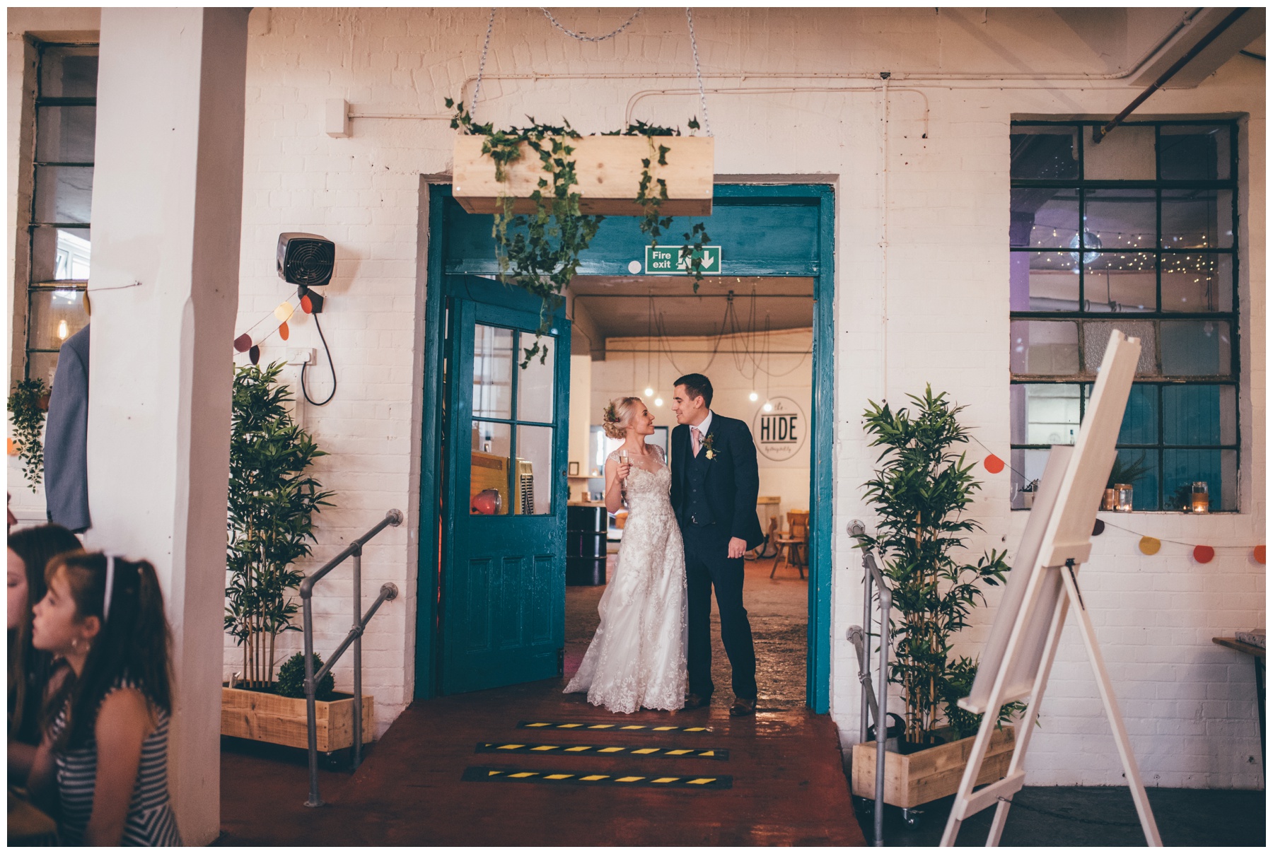 Bride and groom enter the wedding breakfast room at The Hide in Sheffield city centre.