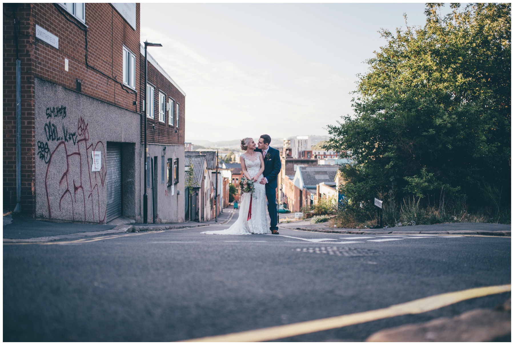 Bride and groom explore the city centre of Sheffield surround The Hide, their cool wedding venue.