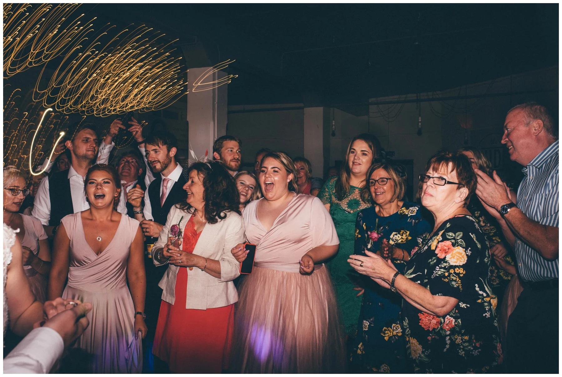 Guests dance at The Hide, a cool, Urban wedding venue in Sheffield.