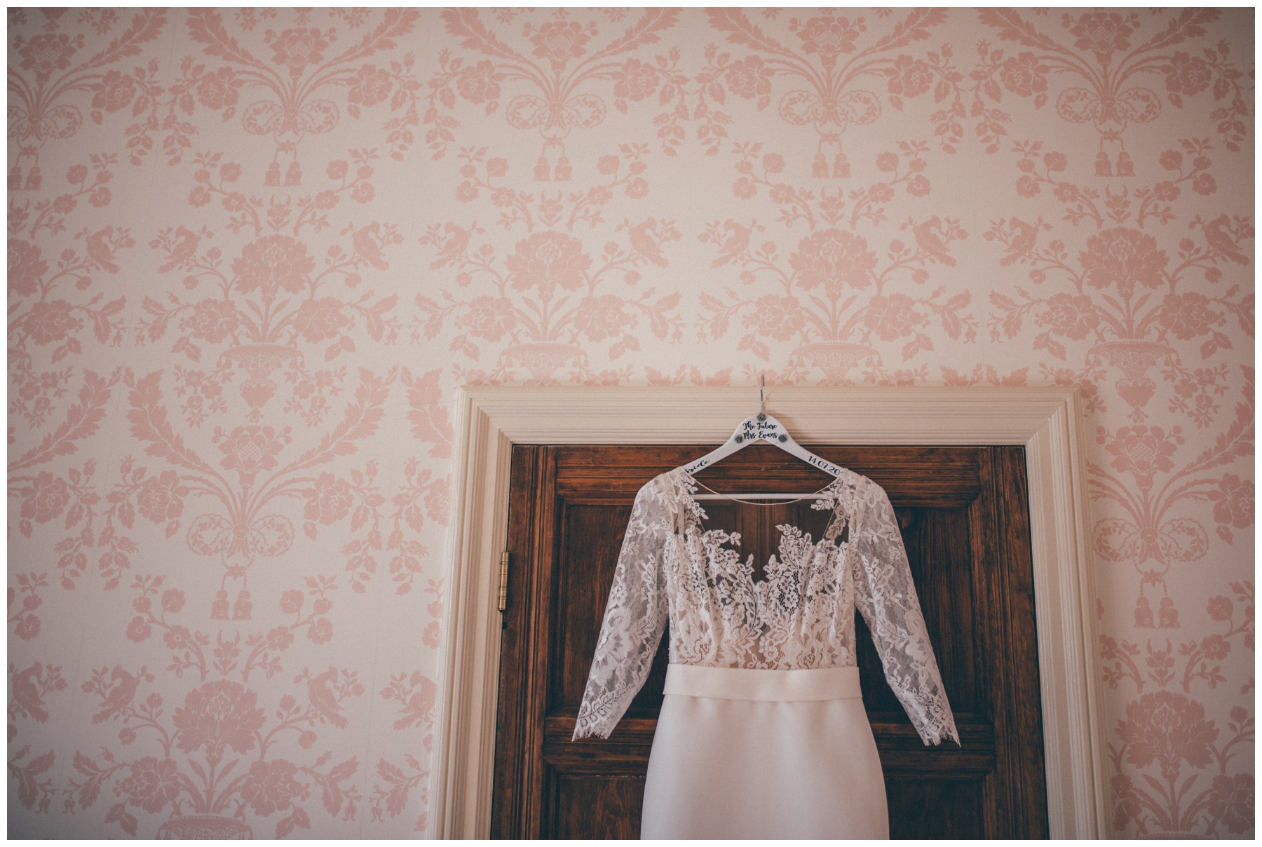 Wedding dress hung up in the bridal suite at Tilstone House in Cheshire.