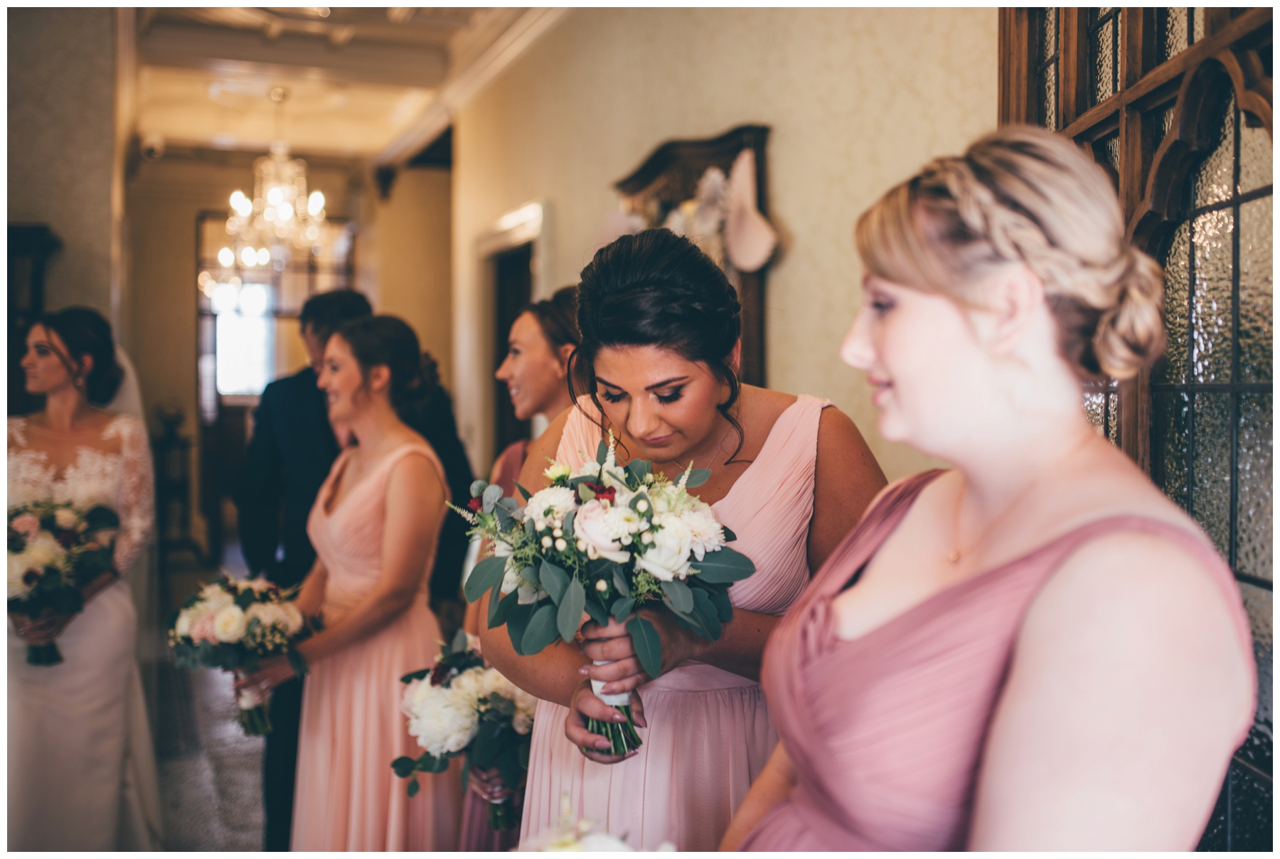 Bridesmaid smelling her lovely spring time bouquet.