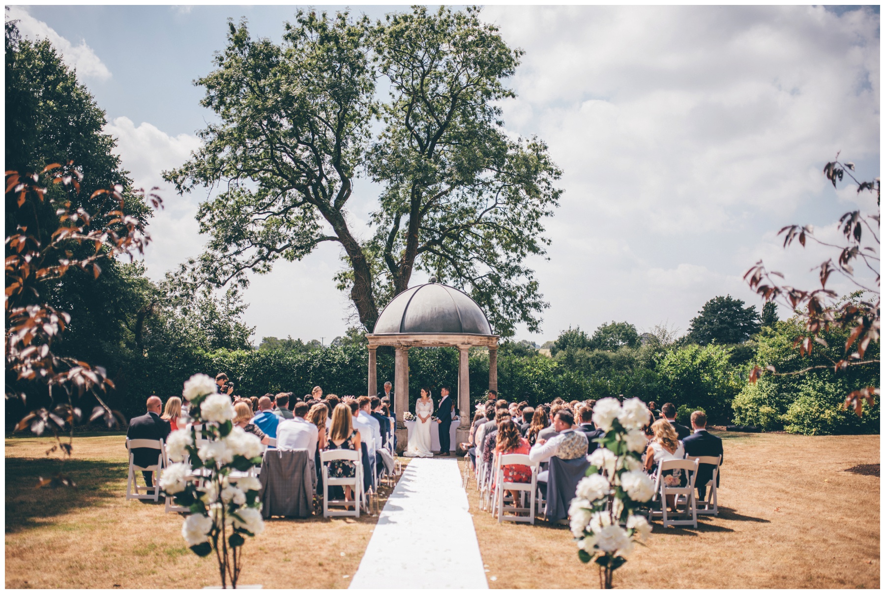 Bride and Groom become husband and wife in an outdoor wedding ceremony at Tilstone House in Tarporley, Cheshire.