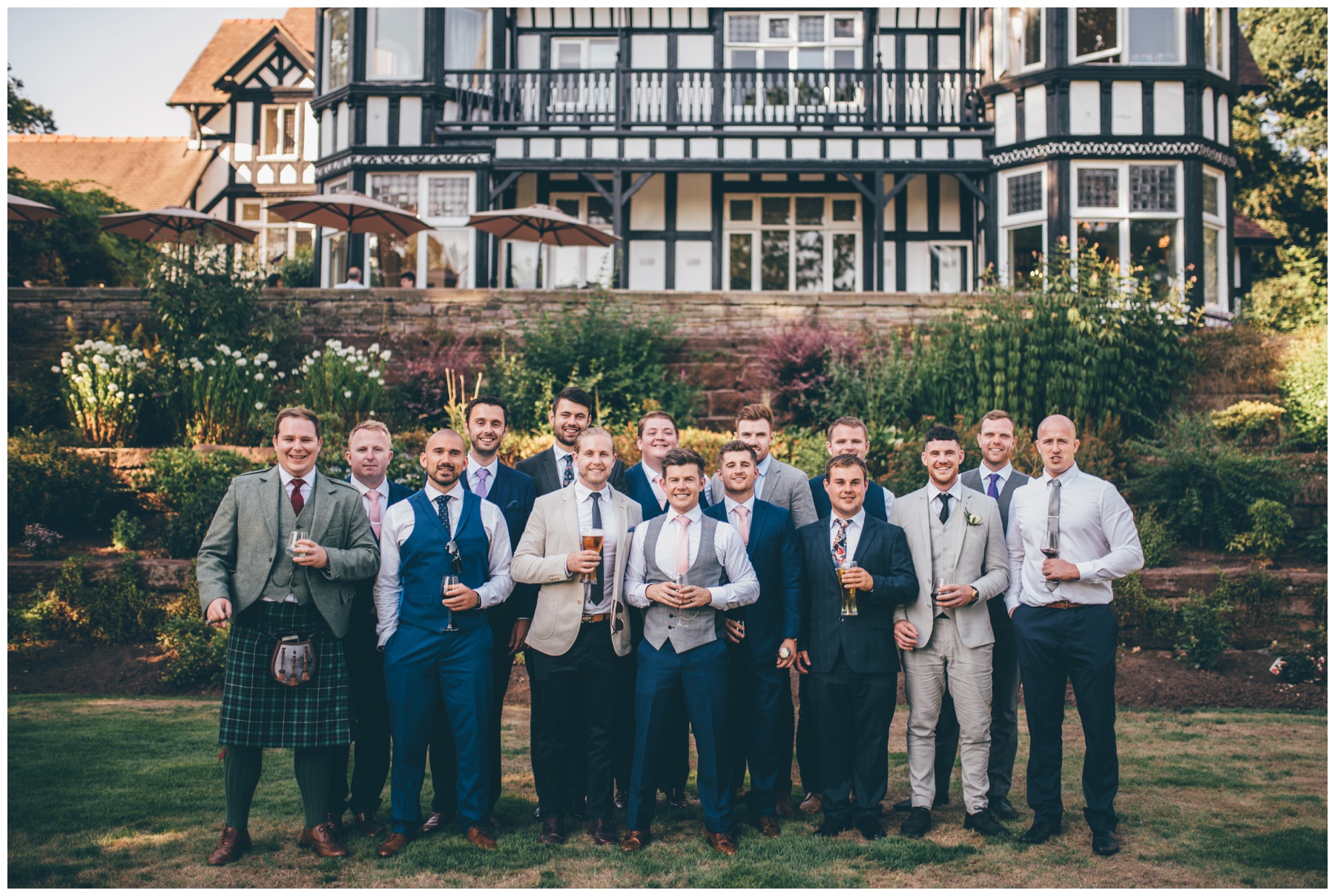 Groom and all his friends outside the wedding venue, Tilstone House. 