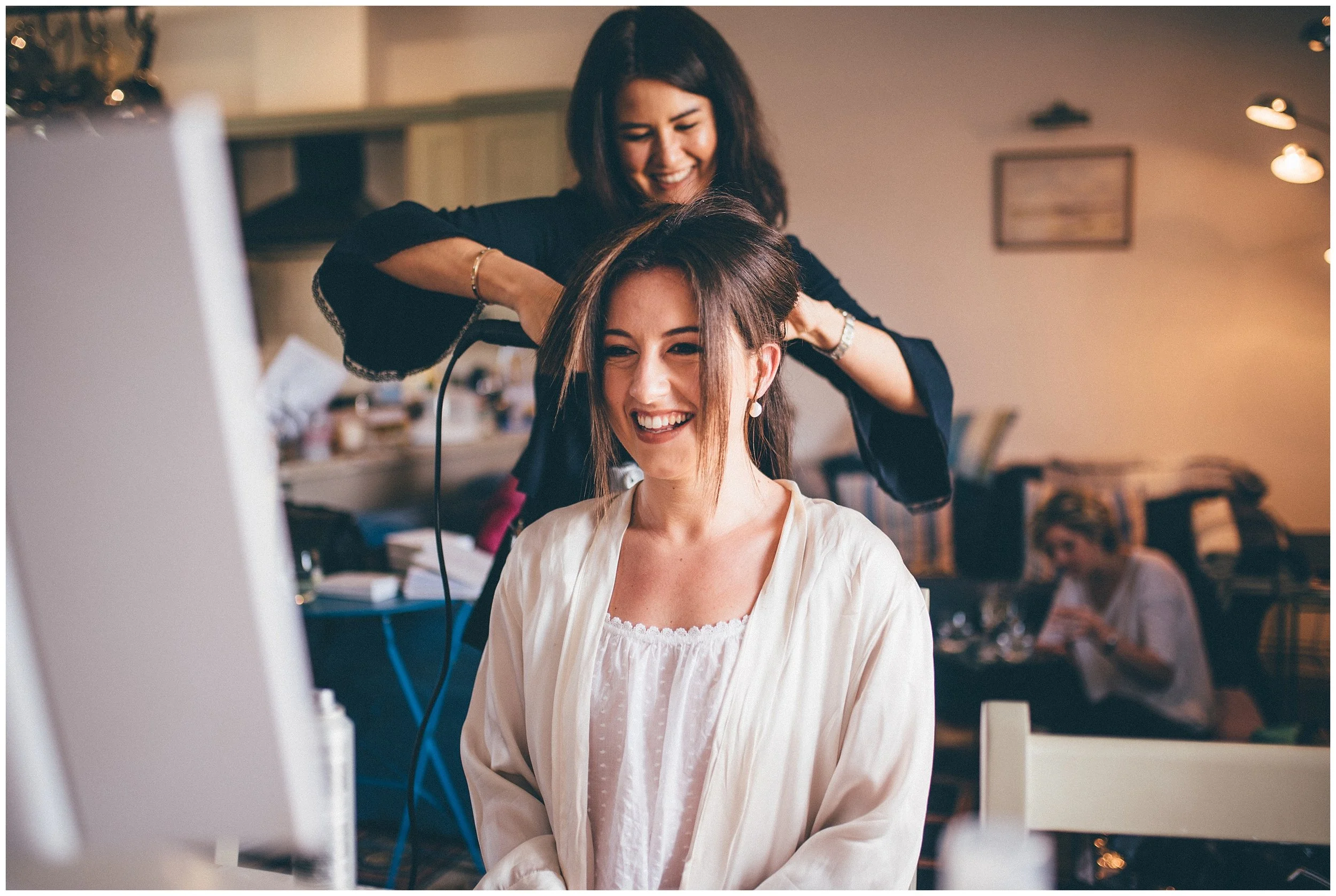 Bride gets her hair done by local MUA, Adie, in Suffolk.