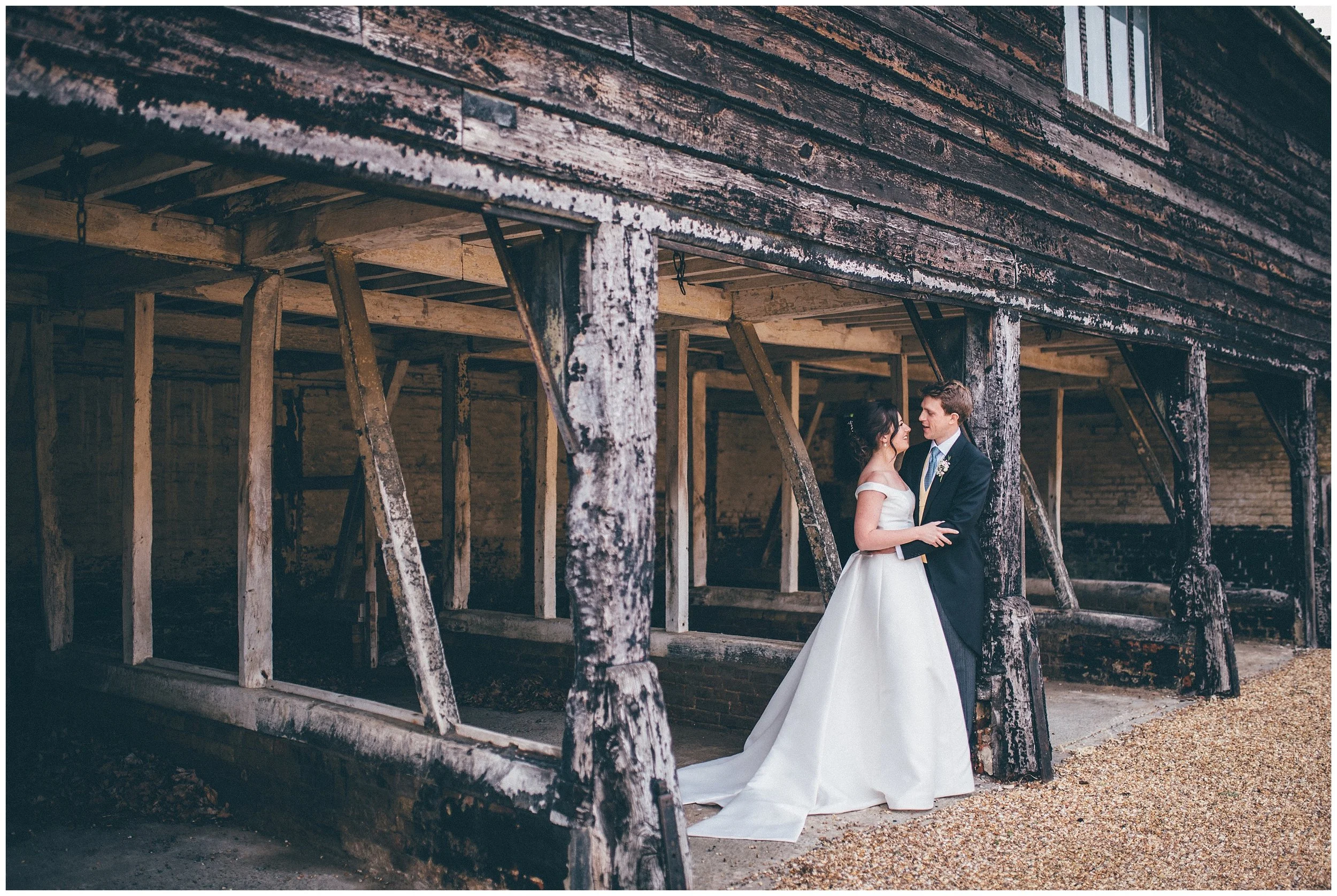 Bride and groom have their wedding photographs taken at Henham Park wedding barns.