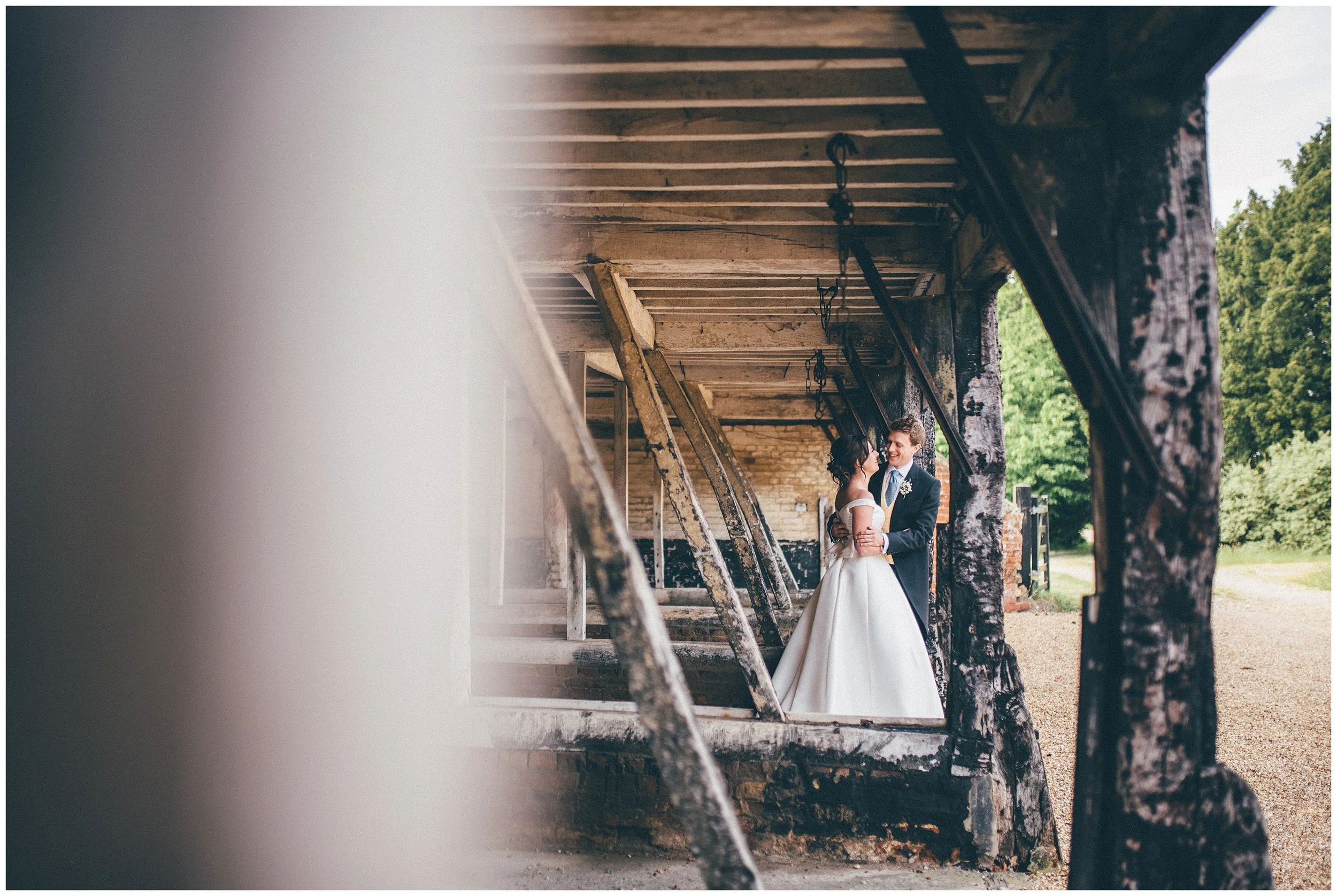Bride and groom have their wedding photographs taken at Henham Park wedding barns.