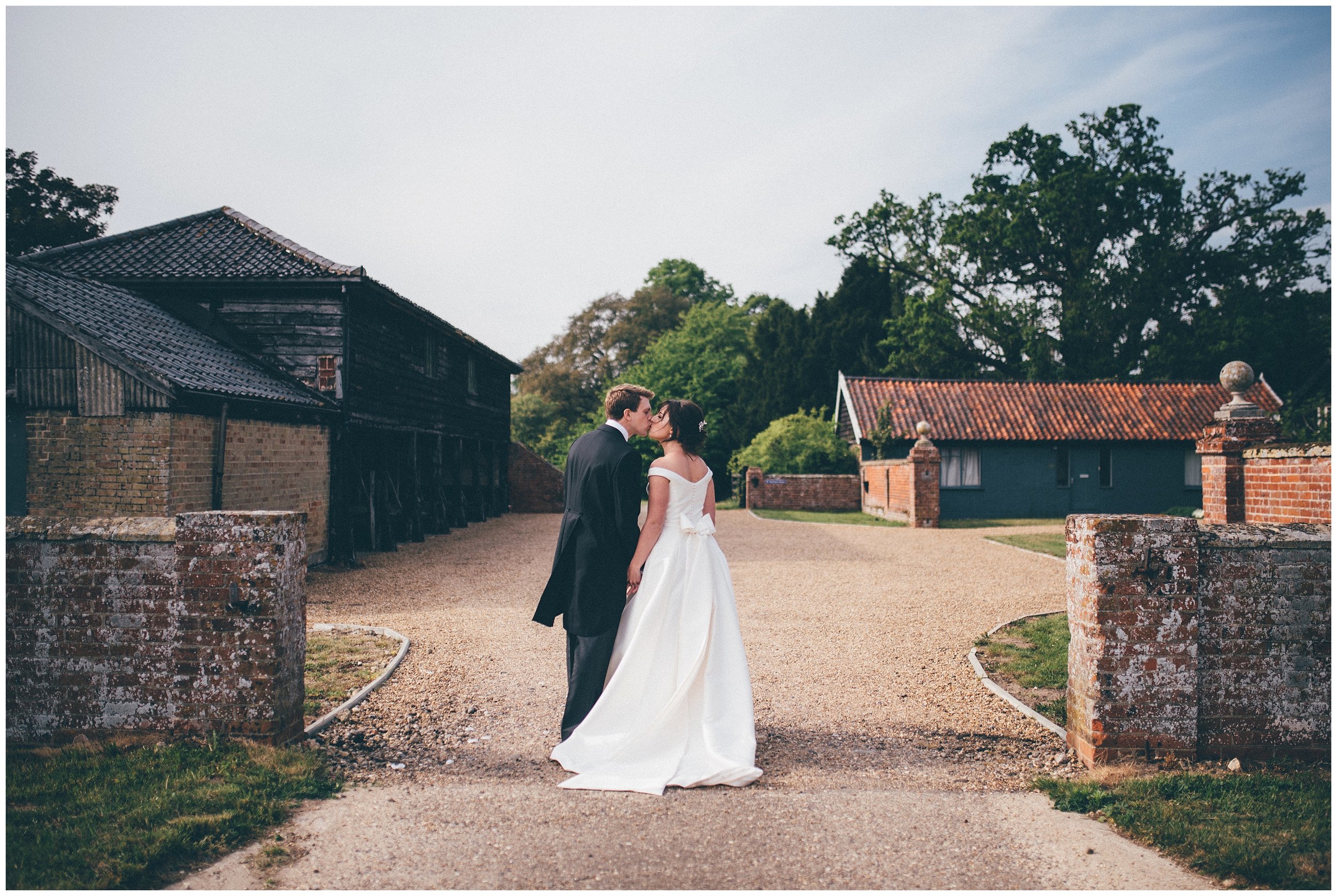 Bride and groom have their wedding photographs taken at Henham Park wedding barns.