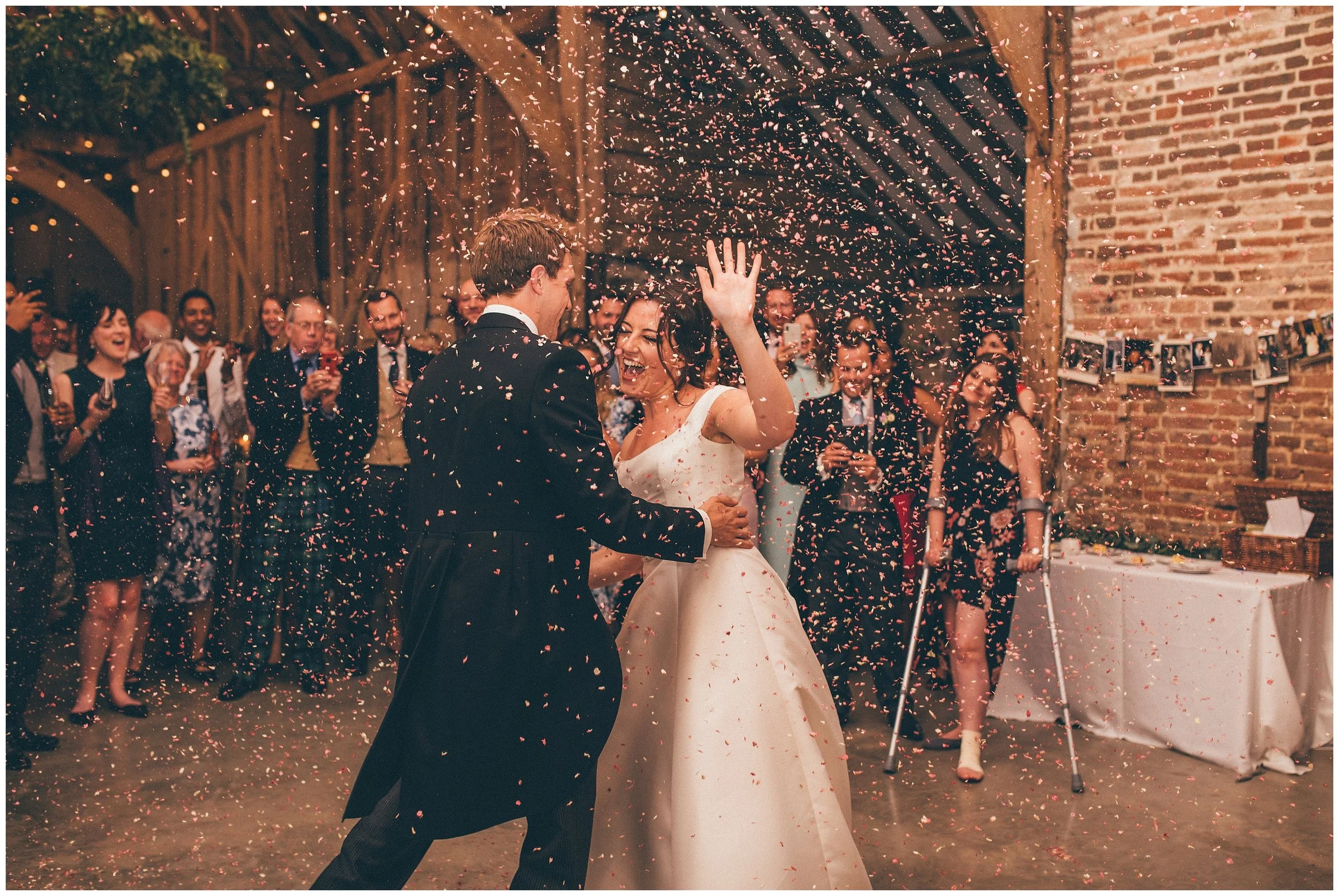 Confetti canon during the First Dance at Henham Park wedding barns in Southwold.