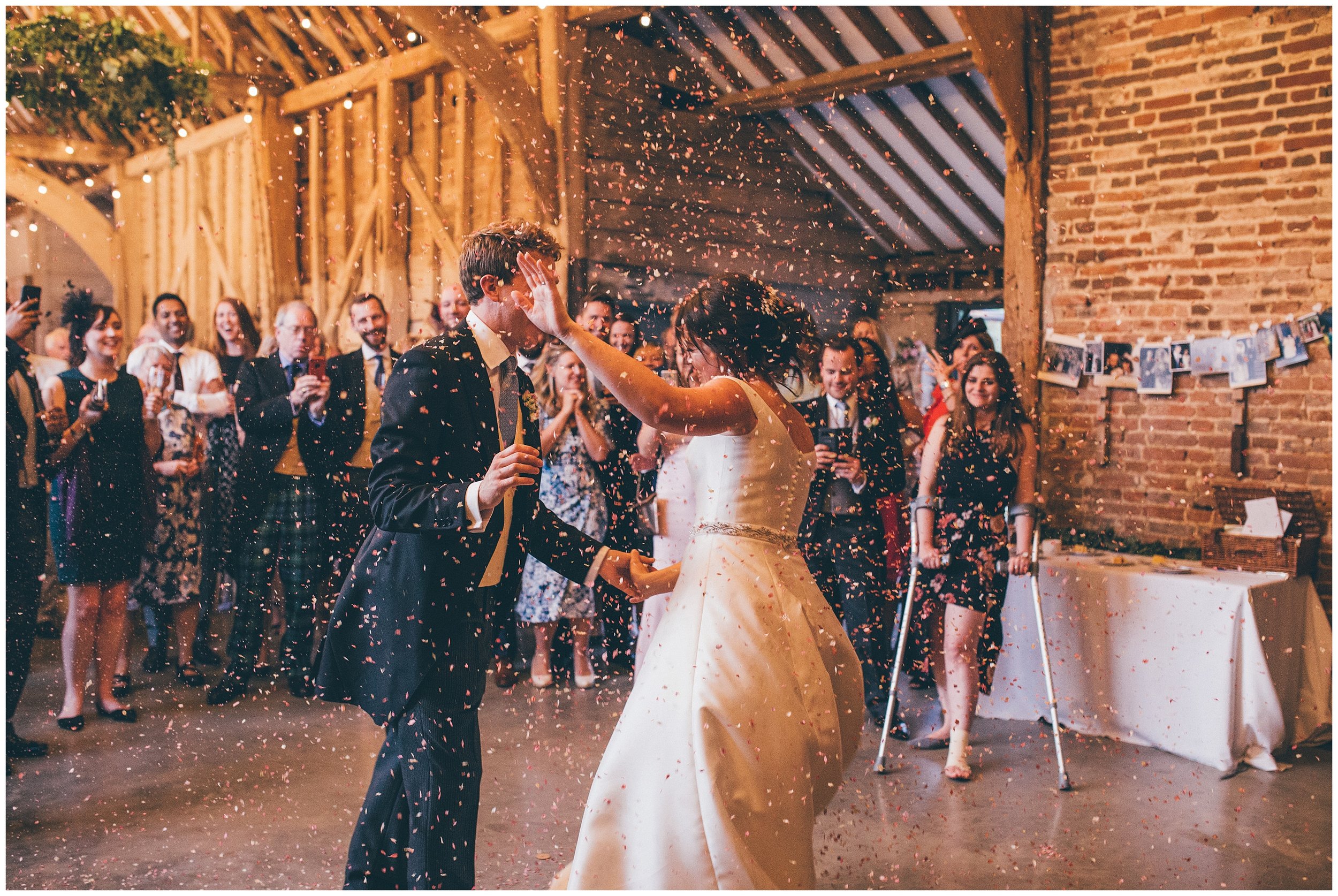 Confetti canon during the First Dance at Henham Park wedding barns in Southwold.