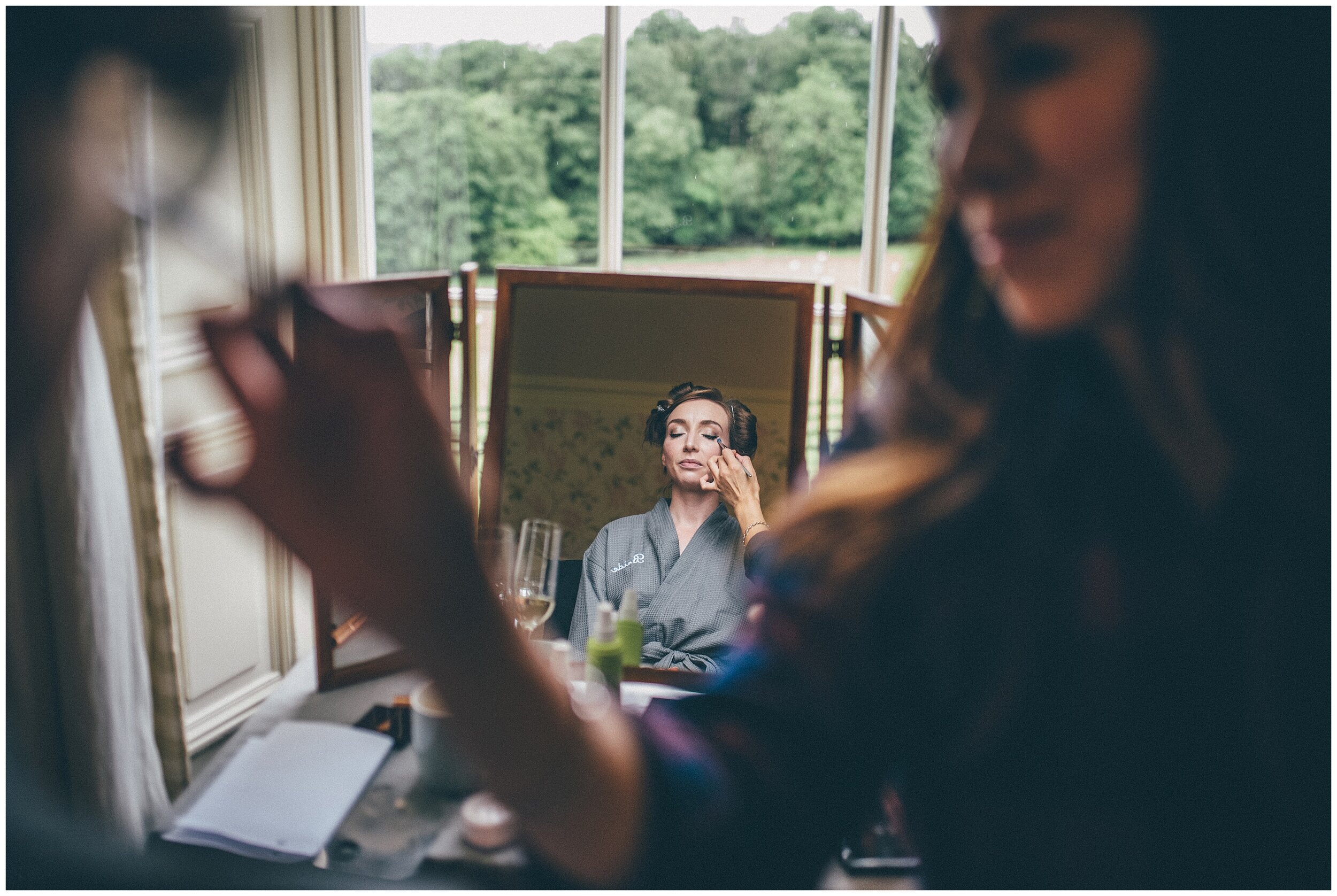 Bride gets her make done on the wedding morning at Silverholme wedding venue.