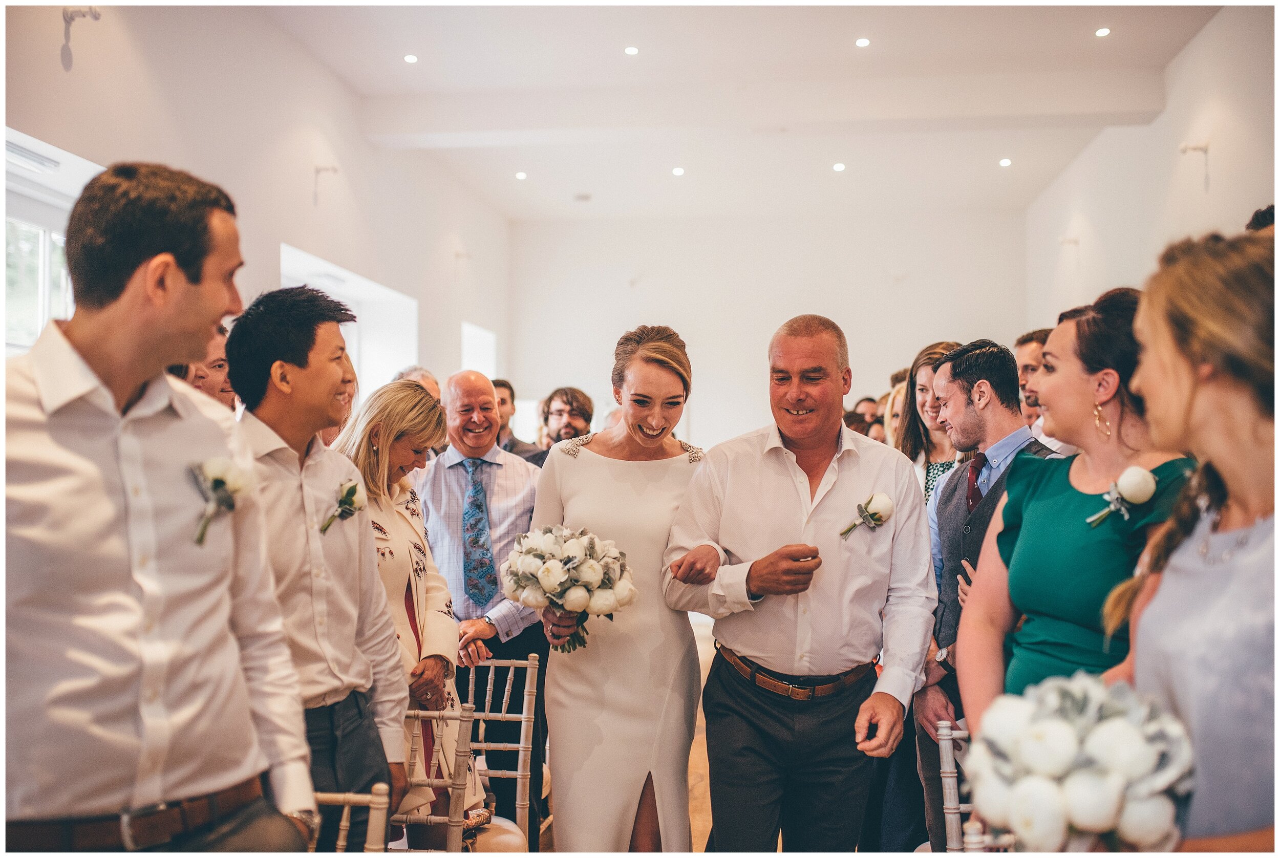 Bride and her dad walk down the aisle at Silverholme Manor.