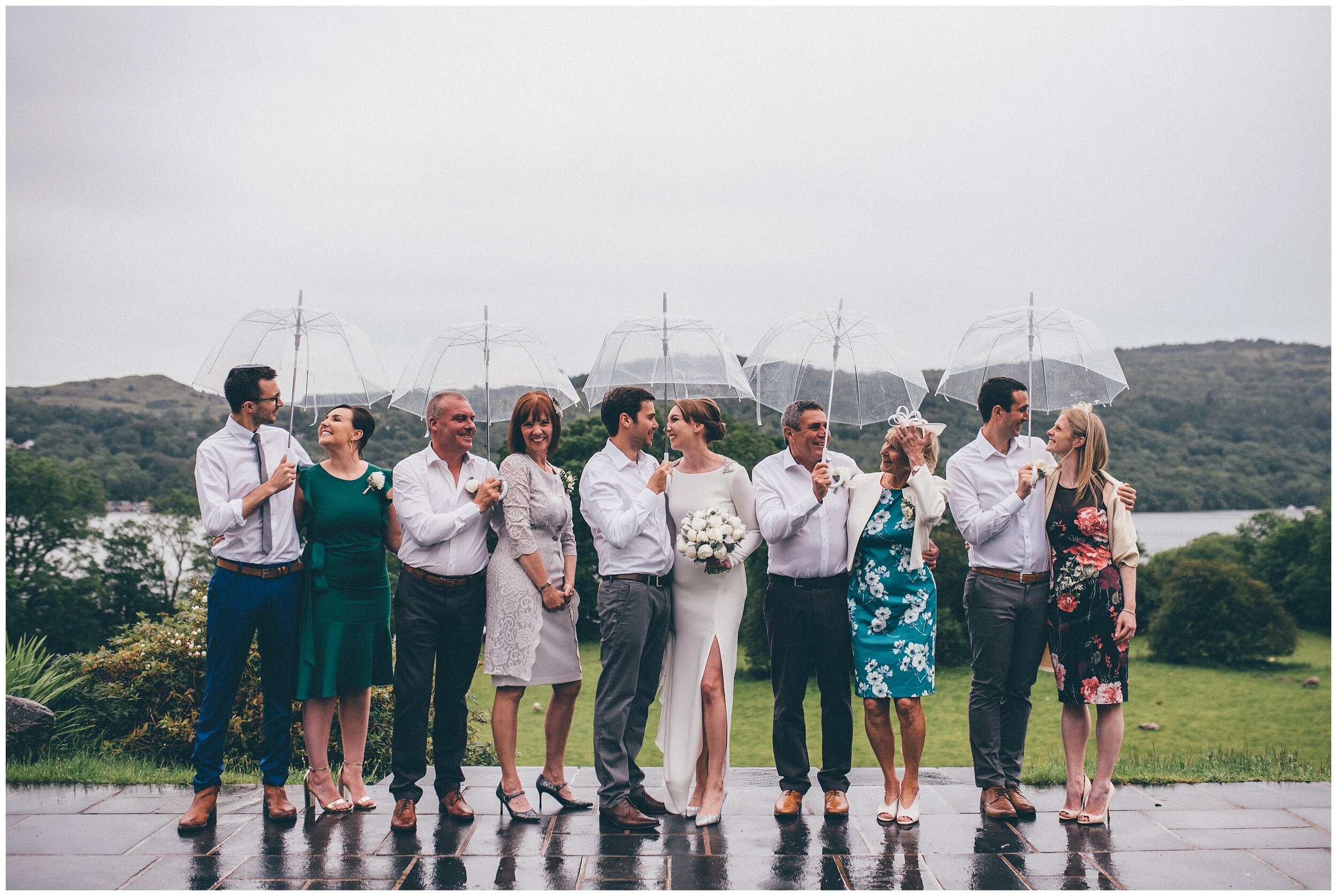Fun family photograph in the rain at Lake Distrct wedding venue.