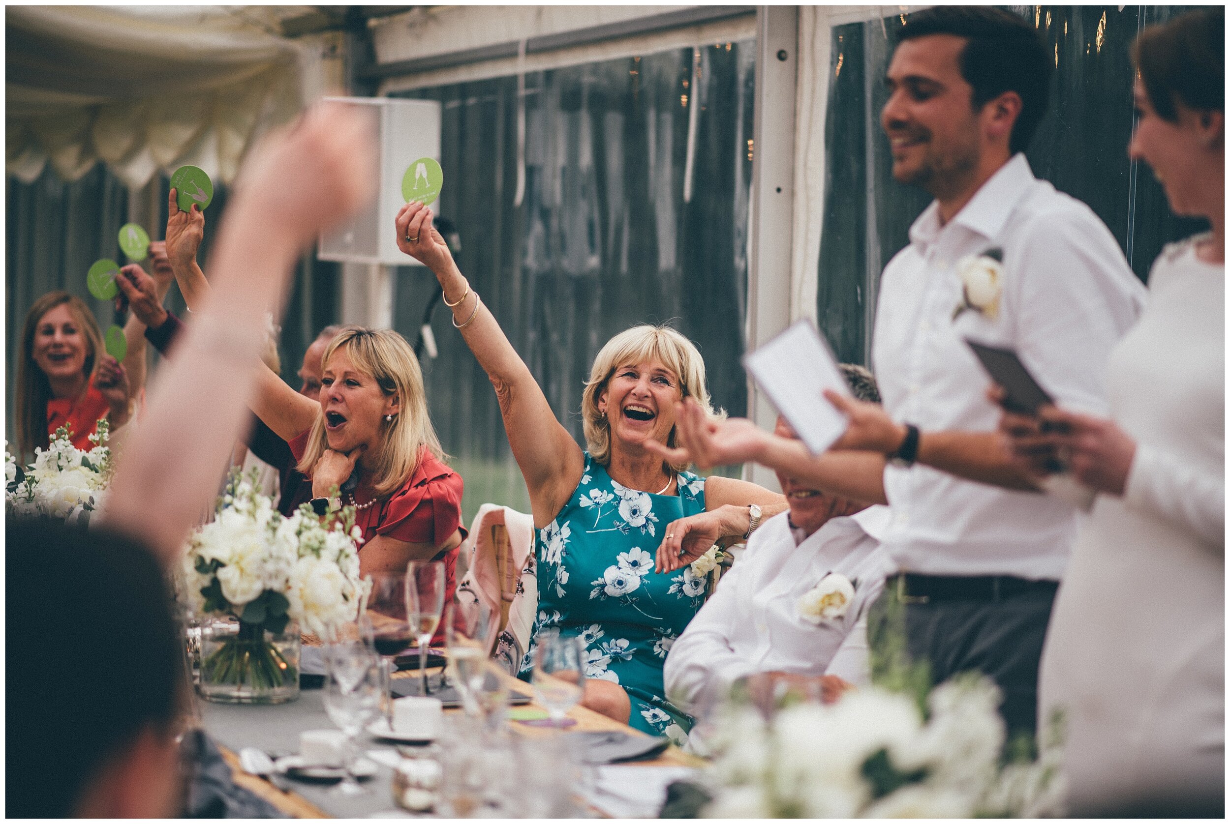 Wedding guests play a game during the speeches at Silverholme Manor, Graythwaite Estate.