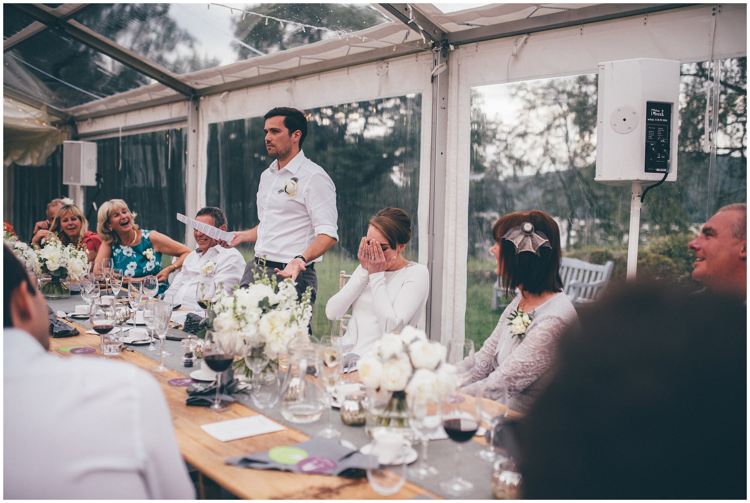 Wedding guests play a game during the speeches at Silverholme Manor, Graythwaite Estate.