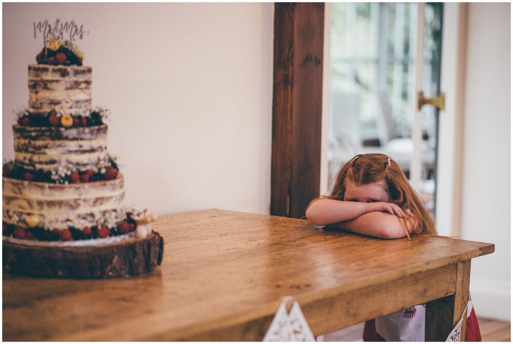 Cute little wedding guest is tired and gets in a mood at Abbeywood Estate in Cheshire.