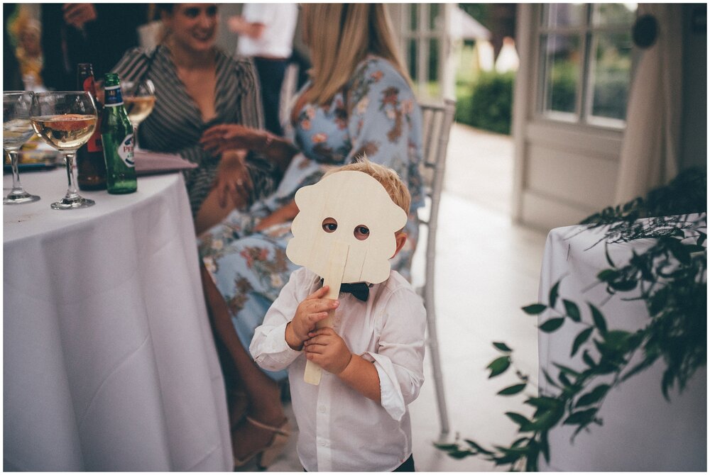 Cute little wedding guest plays at the wedding reception at Lemore Manor.