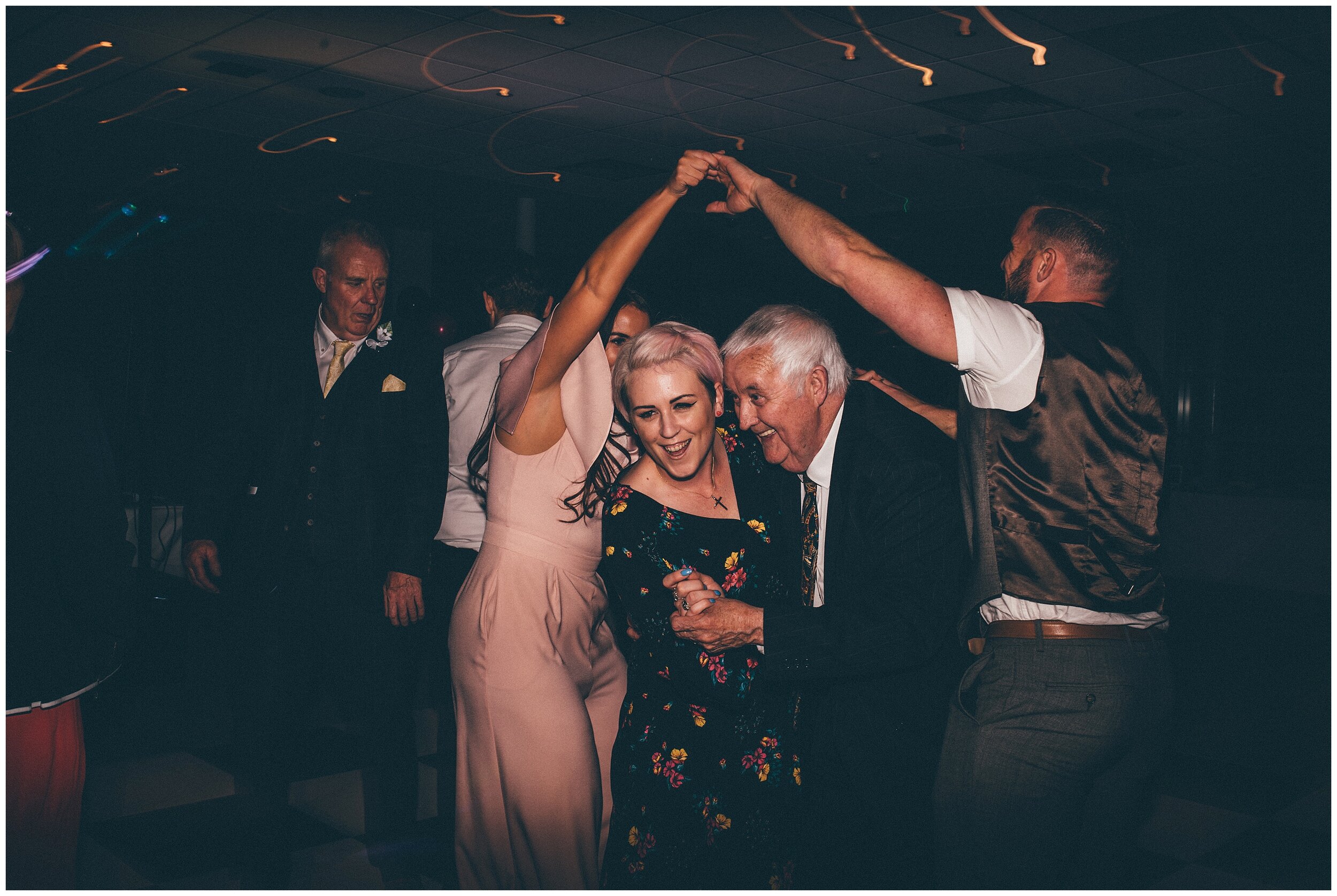 Grandad dances at wedding at Chester Racecourse.