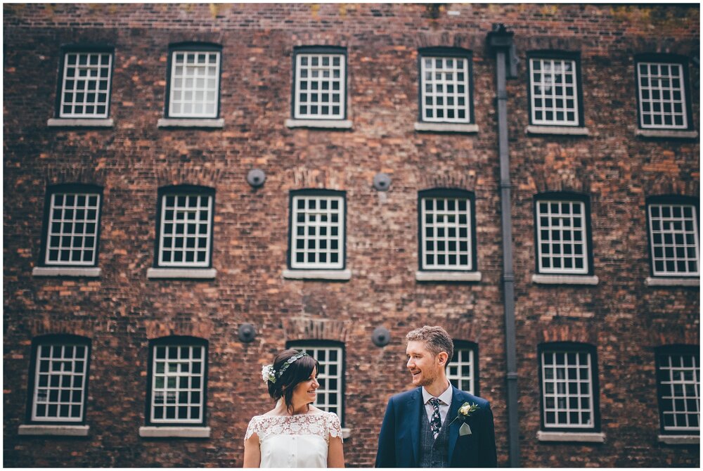 New husband and wife at their wedding at Quarry Bank Mill near Manchester.