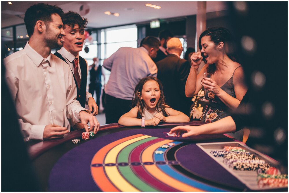 Little guest enjoys the casino tables at Las Vegas themed wedding in Chester.