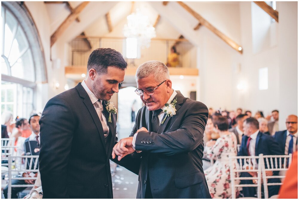 Groom and his dad check their watches waiting for the bride at Lemore Manor.