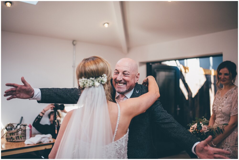 Bride's dad sees his daughter in her wedding dress for the first time at Cheshire wedding.