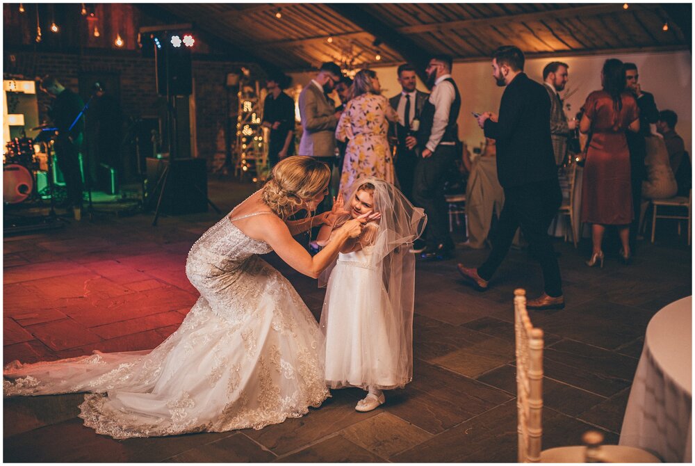 Evening guests enjoying the celebrations at Owen House wedding Barn in Mobberly, Cheshire.