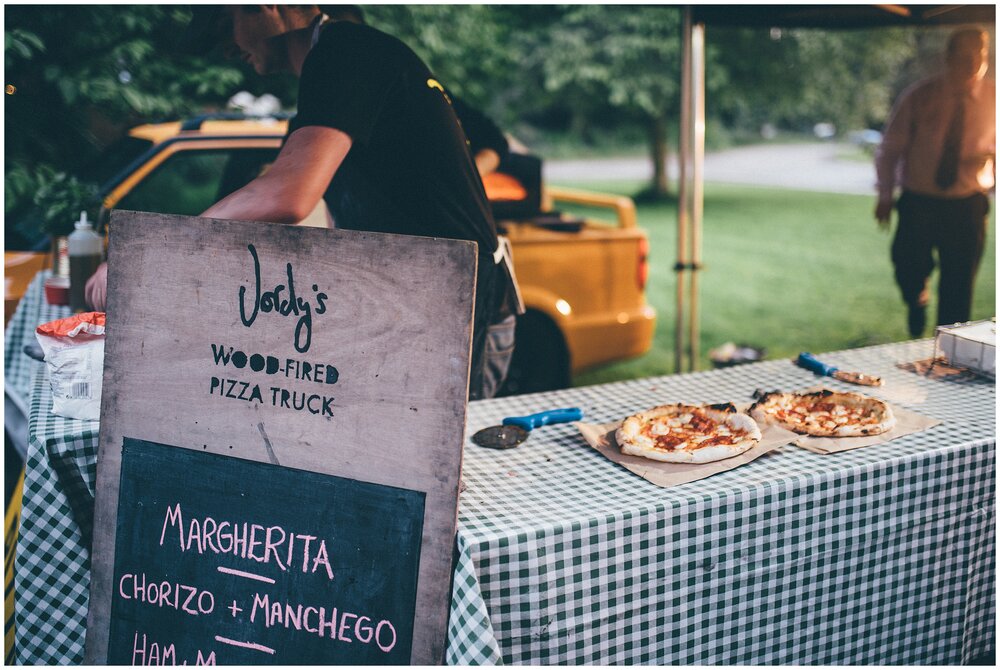 Jordy's pizza truck arrives at the wedding to feed the evening guests at festival themed wedding.