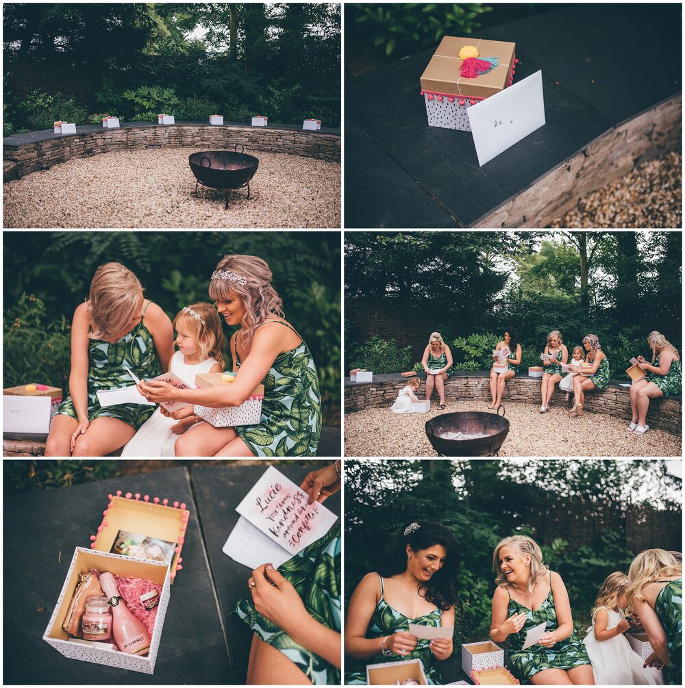 Bridesmaids receive their gift boxes from the bride on the wedding morning at Lemore Manor in Hereford.