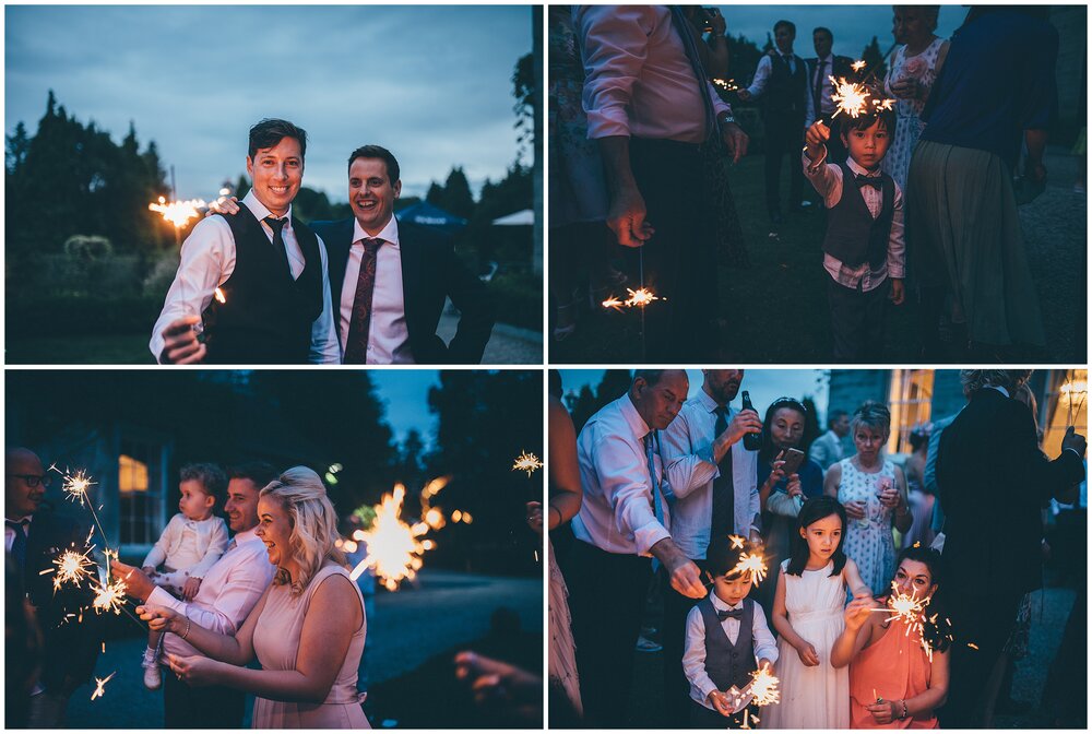 Wedding guests enjoy sparklers at Lemore Manor in Hereford.