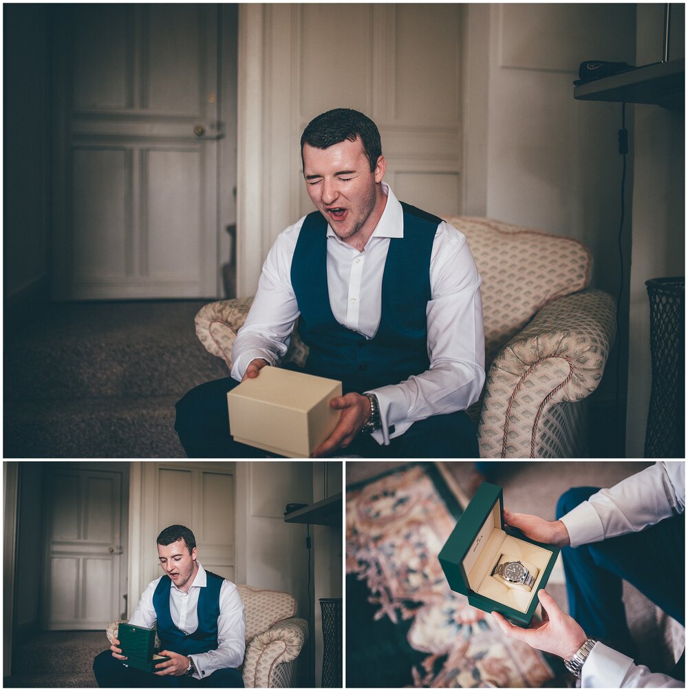 Bride gives groom a Rolex watch on the morning of their wedding at Thornton Manor.