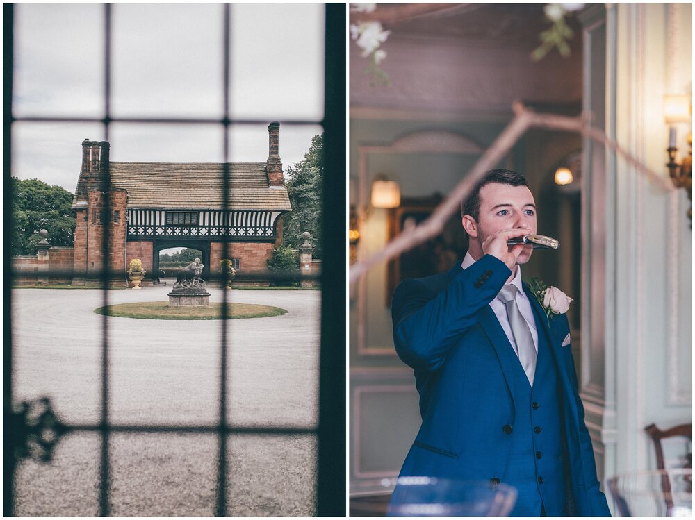 Groom drinks from his hip flask t Wirral Wedding venue, Thornton Manor.