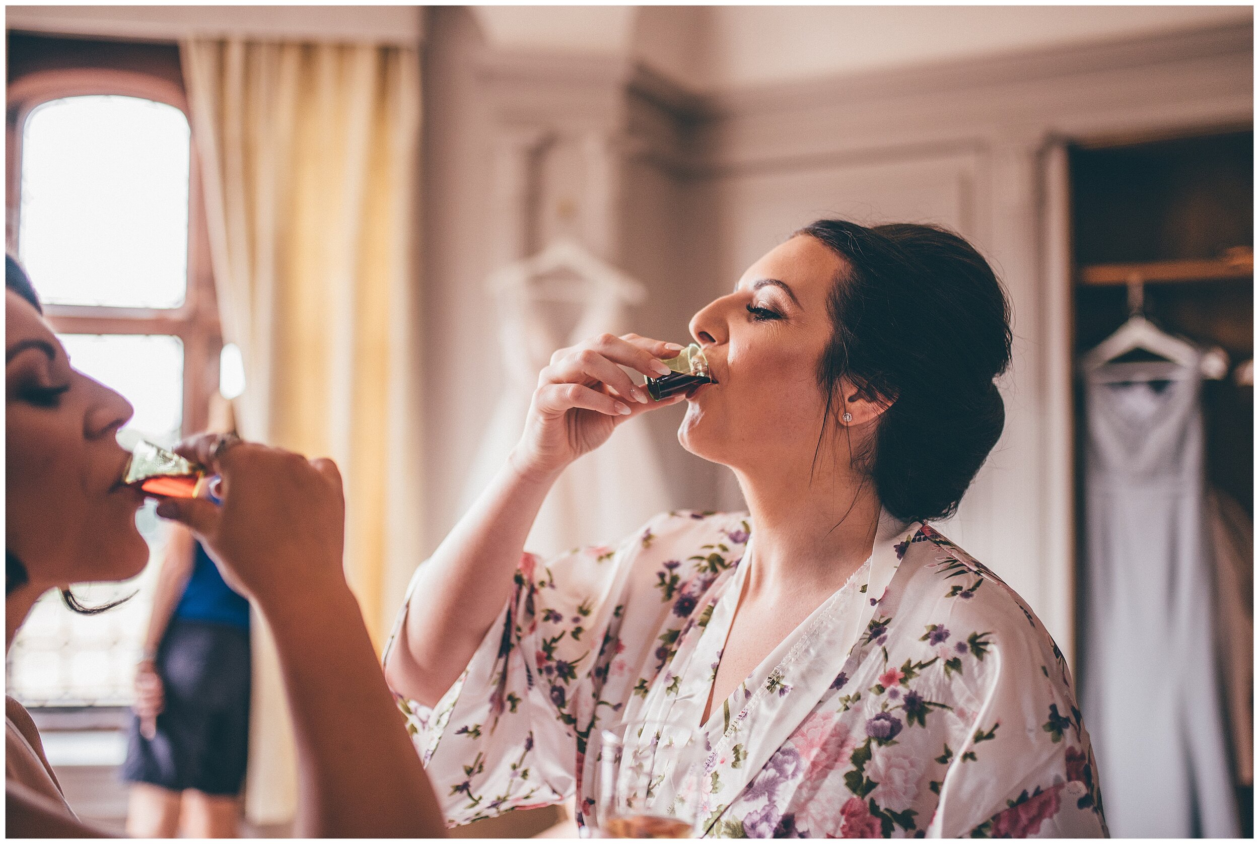 Bride does a shot of Jaegermeister on her wedding morning