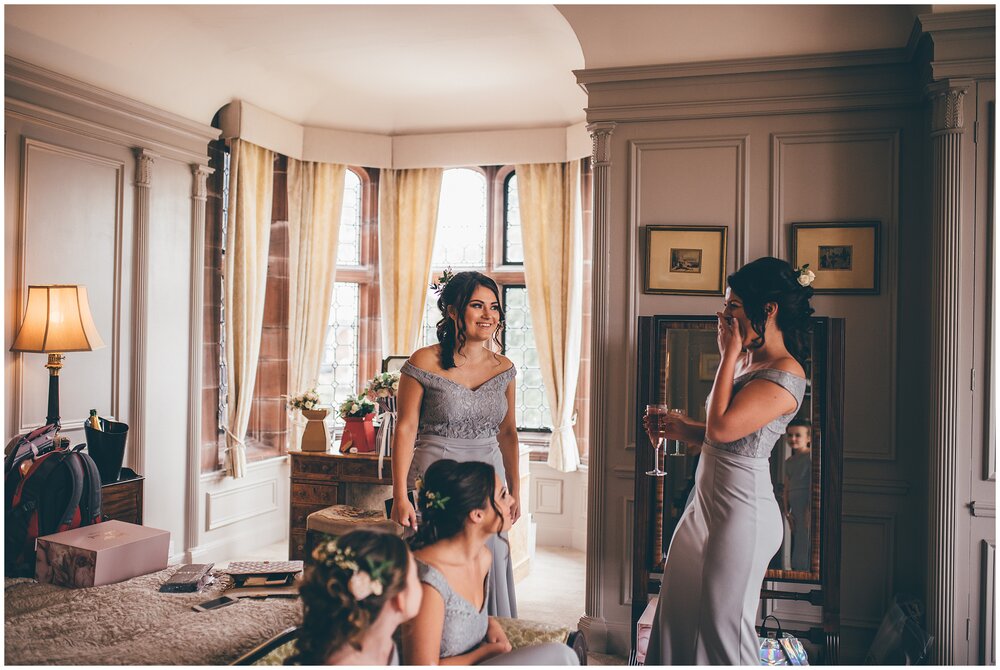 Bridesmaids laugh together at Cheshire wedding.