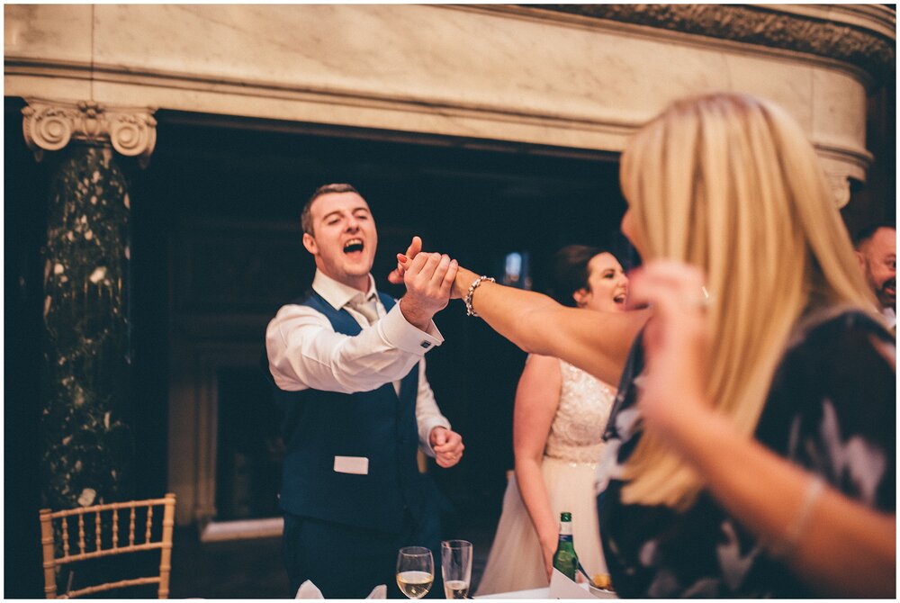 Wedding party enjoy Cheshire singing waiters at Thornton Manor summer wedding.