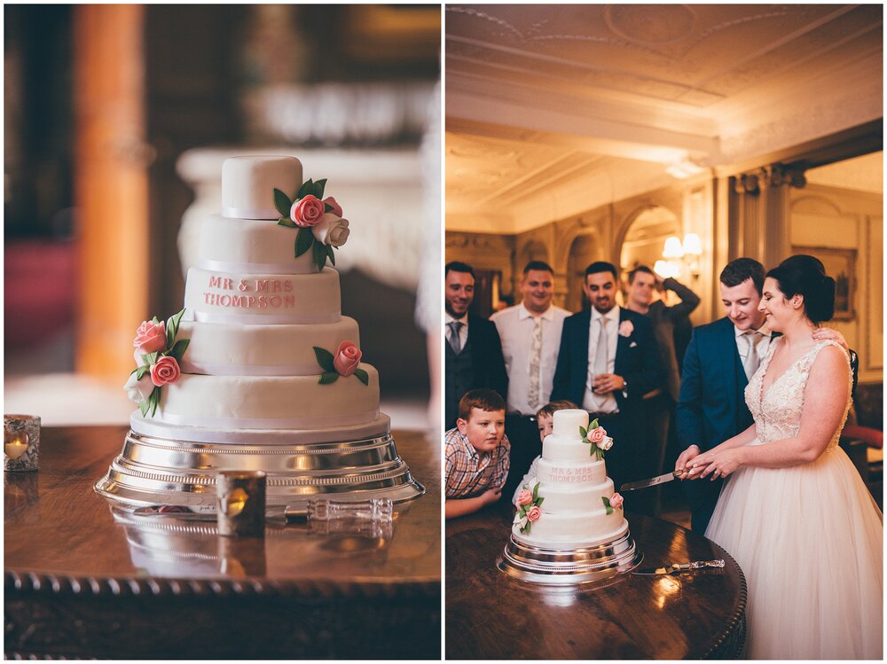 Bride and groom cut the homemade wedding cake