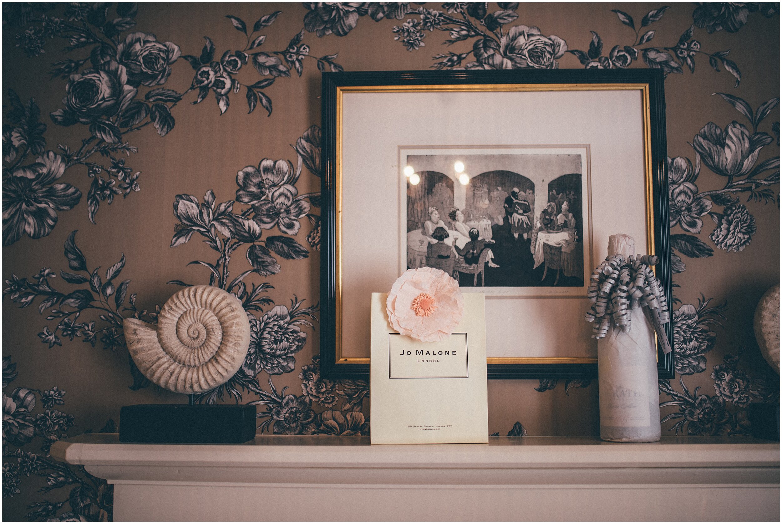Bridal Jo Malone perfume on the mantle piece at her accommodation.