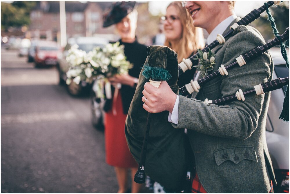 Bagpipe player at a wedding in Melrose Abbey on Scottish Borders.