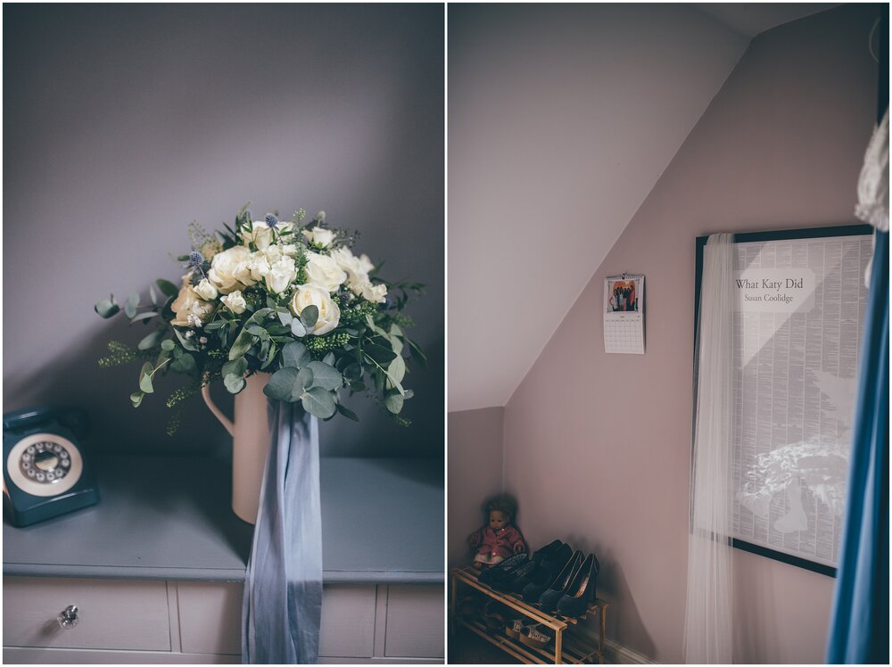 Details of wedding morning with Bridal flowers in a watering can and her veil hanging over a frame in her bedroom.
