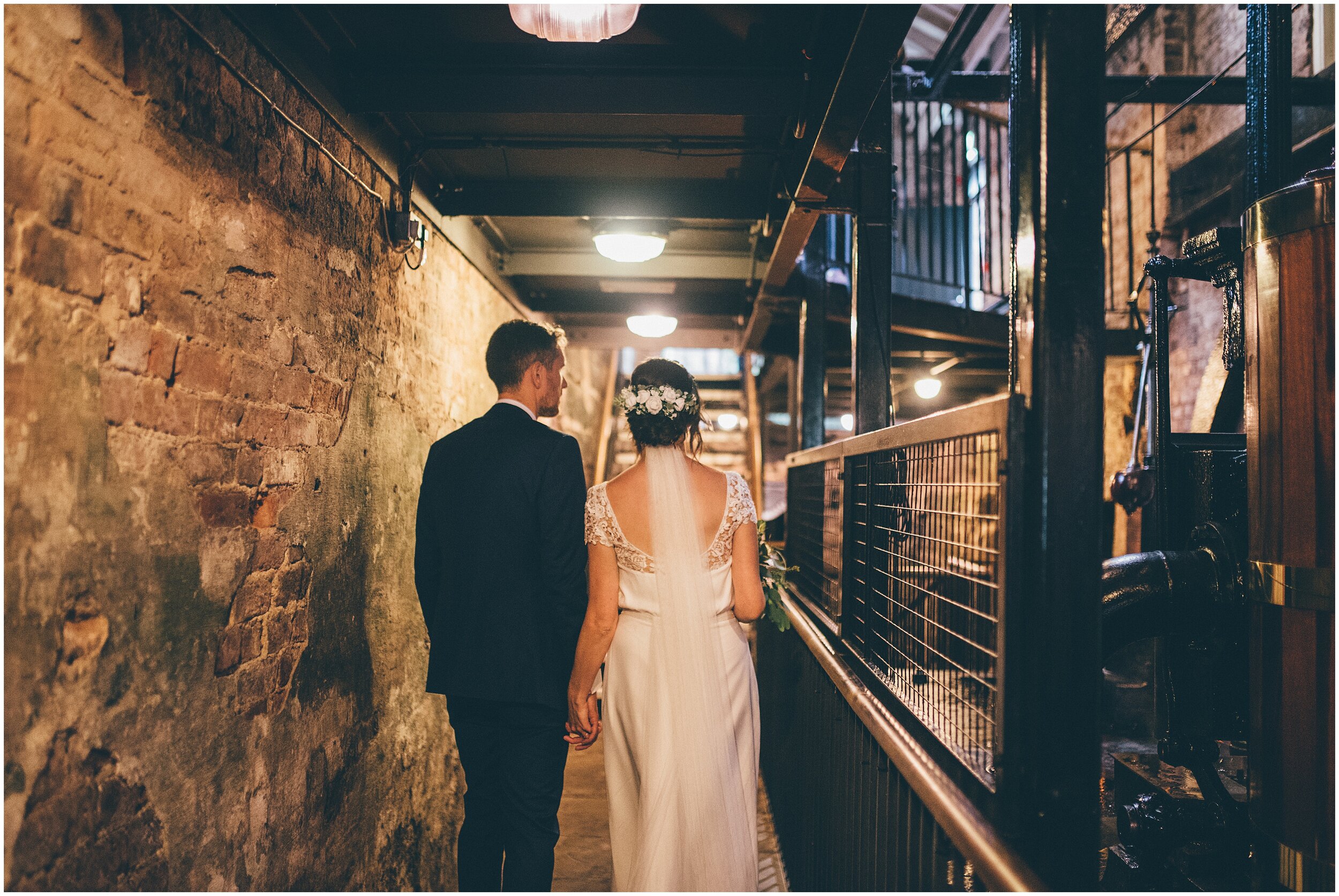 New husband and wife walk around Wedding ceremony Quarry Bank Mill wedding in Cheshire near to Manchester.