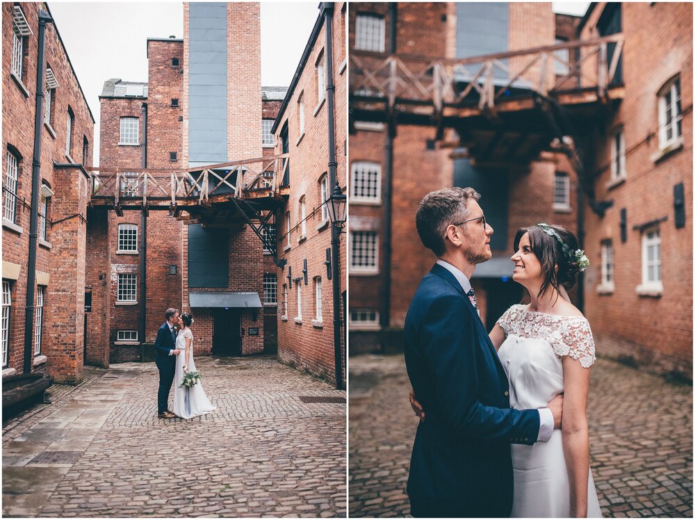 Bride and groom in the courtyard at Quarry Bank Mill wedding in Cheshire near to Manchester.