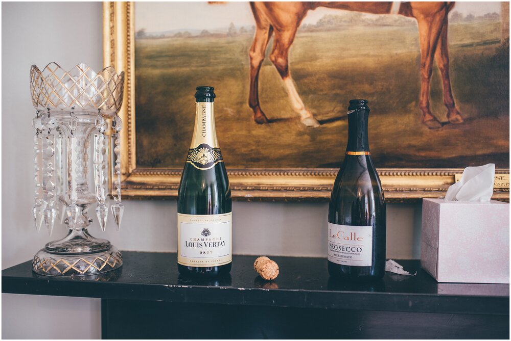 Champagne on the mantlepiece at Chippenham Park Garden wedding