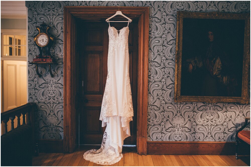 Stunning Pronovias wedding gown hung up before the wedding.