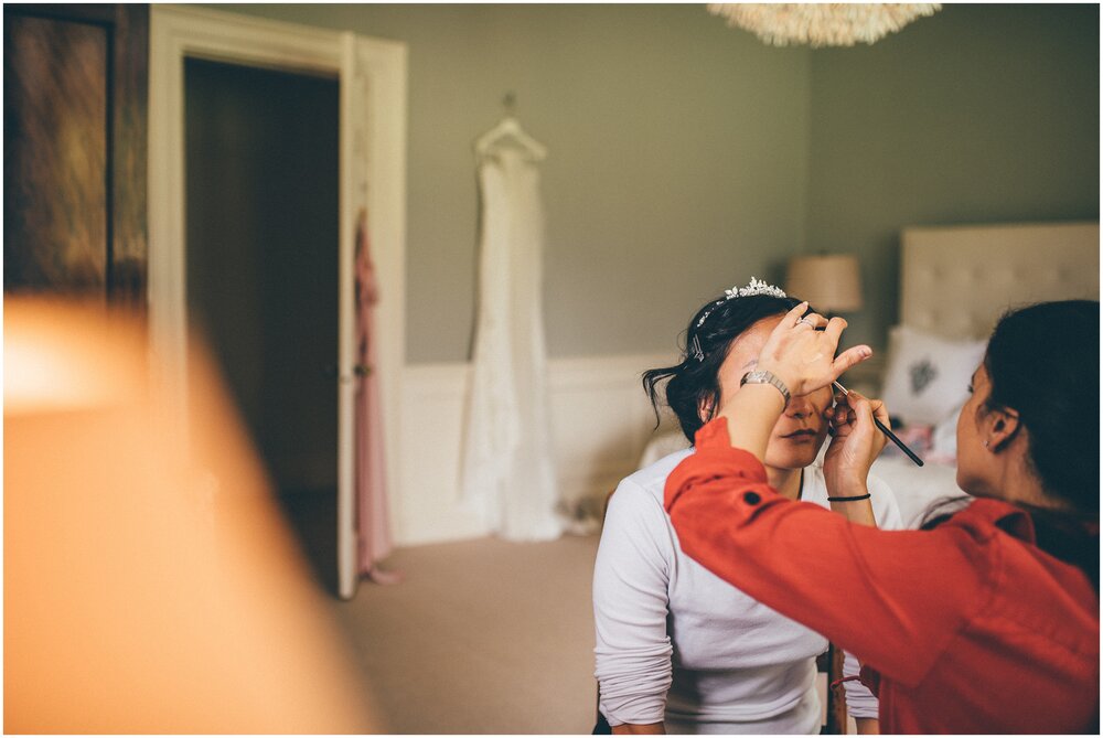 Bide has final makeup applied before her wedding.