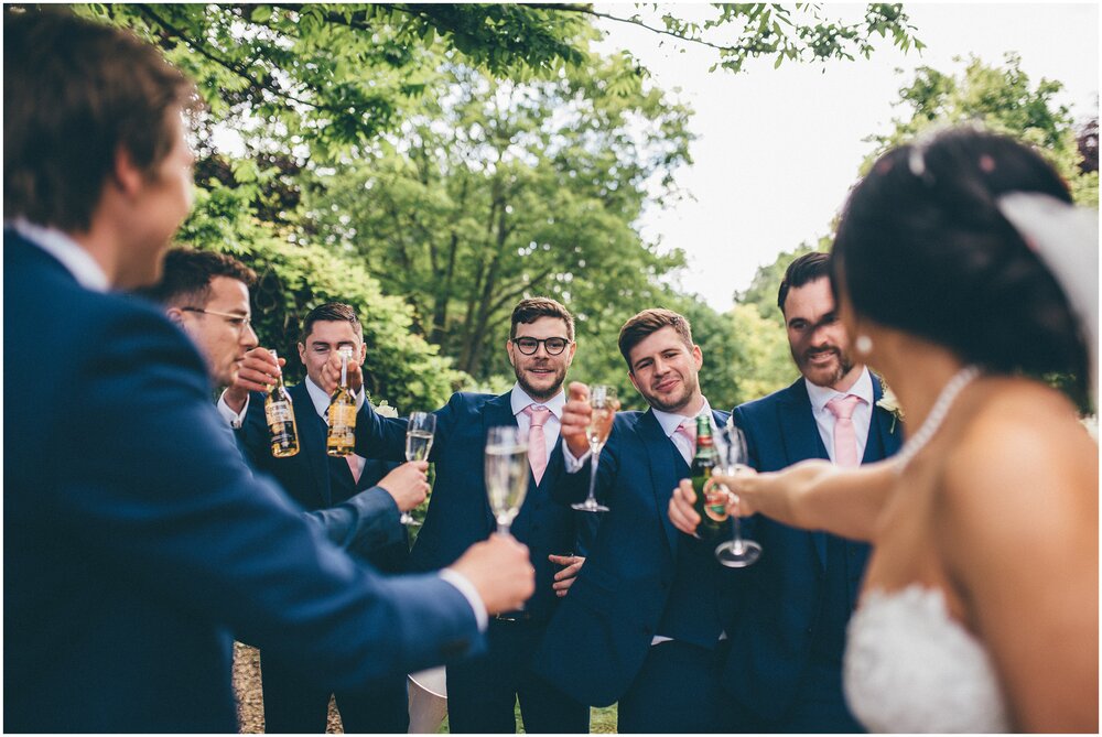 Bride Cheers with all the groomsmen.
