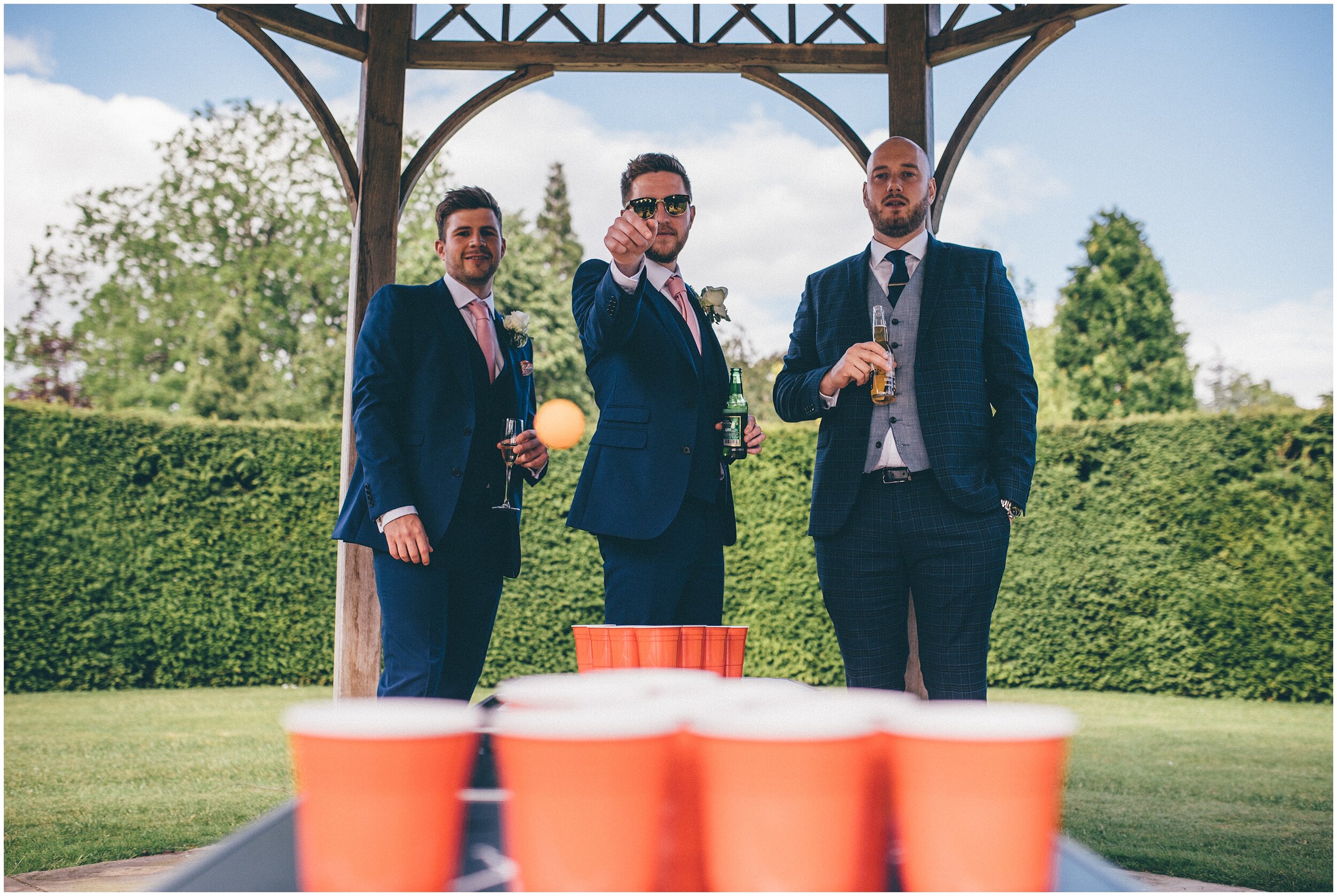 Fun game of Beer pong at a Cheshire wedding.